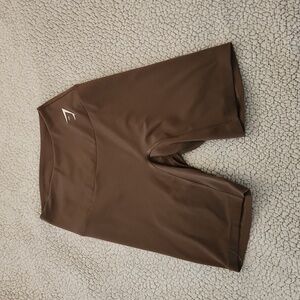 Light brown Gymshark biker workout shorts